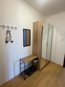 a dressing room with a mirror and a cabinet at Villa Antorini in Sveti Vlas +6 photos