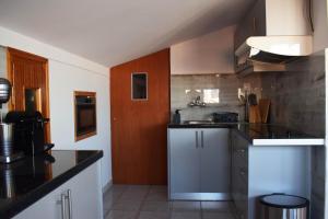 a kitchen with a sink and a counter at Elysian Blue in Petalidi
