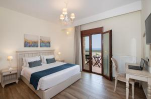 une chambre avec un lit, une table et un bureau dans l'établissement Roupes Villa II, Family villa, Fantastic views, Private pool, à Roúpai 45 autres photos