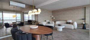 a living room with a couch and a table at GuestReady - Elegant Marina Apartment in Ponta Delgada