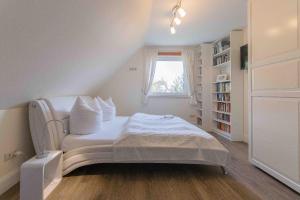 Ένα ή περισσότερα κρεβάτια σε δωμάτιο στο Ferienhaus ANNA