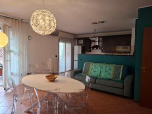 a living room with a table and a couch at B&B Casa Fortunata in Milan +15 photos