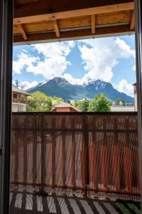 a view of a mountain from a balcony at Appartement cosy rue Pasteur in Briançon