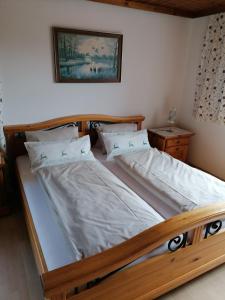 a bedroom with two beds in a room at Bio Bauernhof Vordergschwandtgut in Faistenau