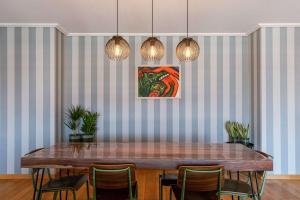 a dining room with a table and chairs at Casiola - Comfortable Apartment with Scenic Views in De Haan