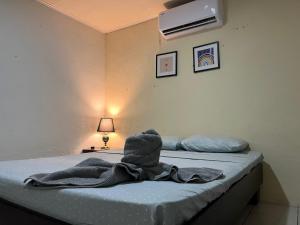 Ένα ή περισσότερα κρεβάτια σε δωμάτιο στο Casa de Campo Nara