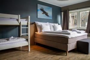 Postel nebo postele na pokoji v ubytování Nordis Hotel Lofoten
