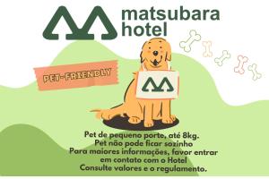a dog holding a sign that reads mitzvah hotel at Hotel Matsubara in Campos do Jordão