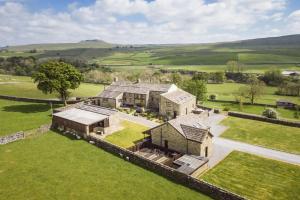 an aerial view of a large house in a field at Hill Top Farm 8 in Bainbridge
