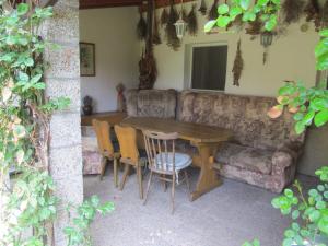 a living room with a table and a couch at V Aleji - ubytování v soukromí in Valtice