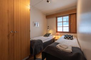 Кровать или кровати в номере Kuukkeli Apartments Saarisatu ja Urupää