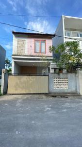 a house with a fence in front of it at 2 Bedroom Villa In Sanur Harbour in Sanur +16 photos