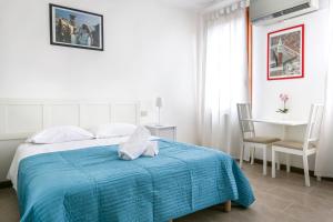 Posteľ alebo postele v izbe v ubytovaní Inlaguna