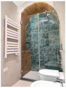 a bathroom with a shower with a toilet in it at Modern Retrò Alloggio Vacanze in Molfetta +13 photos