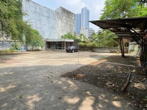 a parking lot with a car parked in front of a building at Casa Katipunan in Manila