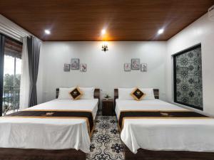 Ένα ή περισσότερα κρεβάτια σε δωμάτιο στο An Peaceful Homestay