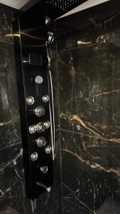 a control panel of an oven with silver buttons at Evasion balneo Fréjus in Fréjus