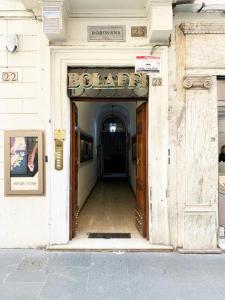 an entrance to a building with a sign that reads hospital at Piazza Di Spagna Prestige in Rome