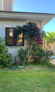 a house with a window on the side of it at Villa Azalea in Grand Baie