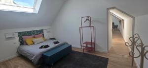 En eller flere senge i et værelse på Gîte