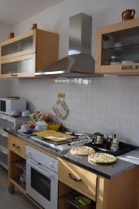 A kitchen or kitchenette at Casa Vacanza e per lavoro Tessyhouse