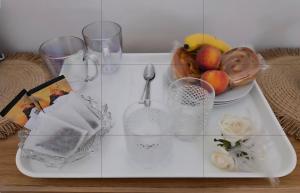 a glass table with a plate of fruit on it at Catalina19 Guest home share in Poole