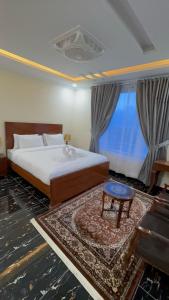 Vuode tai vuoteita majoituspaikassa Relax Inn Skardu