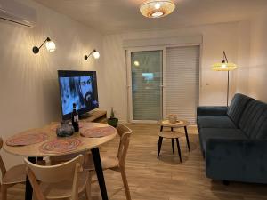 a living room with a table and a couch at La Mata Apartment, Spain in La Mata