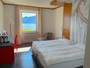 Postelja oz. postelje v sobi nastanitve Albergo Carcani by Ketty & Tommy