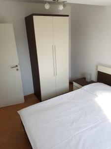 Postel nebo postele na pokoji v ubytování Apartments Villa Maslinica