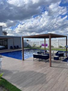 a patio with a pool and a pavilion at São João do Teixeira - 2 QUARTOS - 3 CAMAS DE CASAL in Caruaru