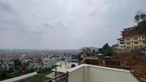 a view of a city from the top of a building at Tise Homestay in Bālāju
