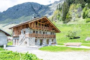 a building with a balcony on the side of it at Chalet Gaston in Champagny-en-Vanoise