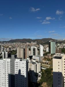 a view of a city with many tall buildings at Raja Vista da Serra in Belo Horizonte