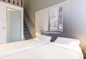Postel nebo postele na pokoji v ubytování B&B HOTEL Moulins