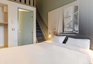 Postel nebo postele na pokoji v ubytování B&B HOTEL Moulins
