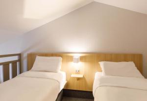 Postel nebo postele na pokoji v ubytování B&B HOTEL Moulins