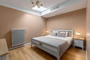 Postel nebo postele na pokoji v ubytování Roze Kūrmājas Residence