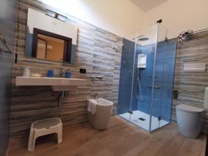 a bathroom with a shower and a sink and a toilet at Il Giardino del Sol in San Vito lo Capo +34 photos