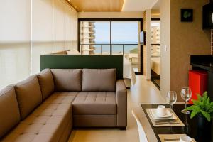 Uma área de estar em Reserva Madero Loft Natal Hotel