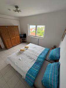 a bedroom with a bed and a window at Apartments Lili in Senj