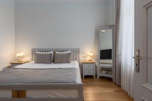 Postel nebo postele na pokoji v ubytování Roze Kūrmājas Residence