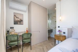 Ένα ή περισσότερα κρεβάτια σε δωμάτιο στο SUITE DELUXE - Monaco - Vue Mer