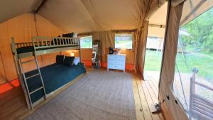 a bedroom with a bunk bed in a tent at On The Lake #116 in Onalaska +5 photos