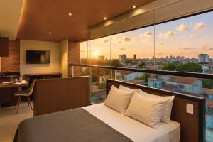 Uma área de estar em Reserva Madero Loft Natal Hotel