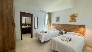 Ένα ή περισσότερα κρεβάτια σε δωμάτιο στο Villa Tierra