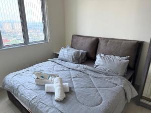 Giường trong phòng chung tại Cozy Stay Nexus Kajang Convenient City Access +25 ảnh