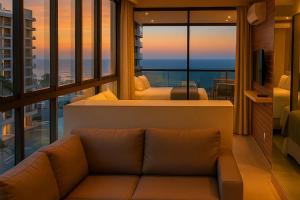 Uma área de estar em Reserva Madero Loft Natal Hotel