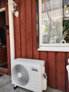 a fan sitting outside of a building next to a window at Haus Waldblick in Extertal