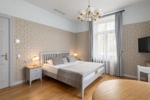 Postel nebo postele na pokoji v ubytování Roze Kūrmājas Residence